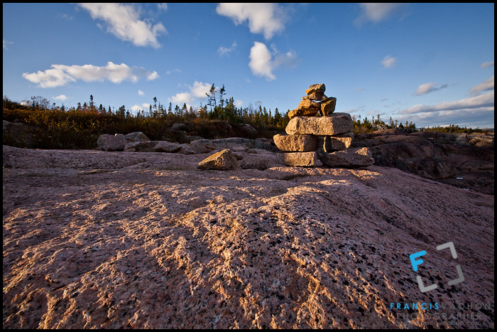 Inuksuk overlooking the St. Lawrence river in Essipit